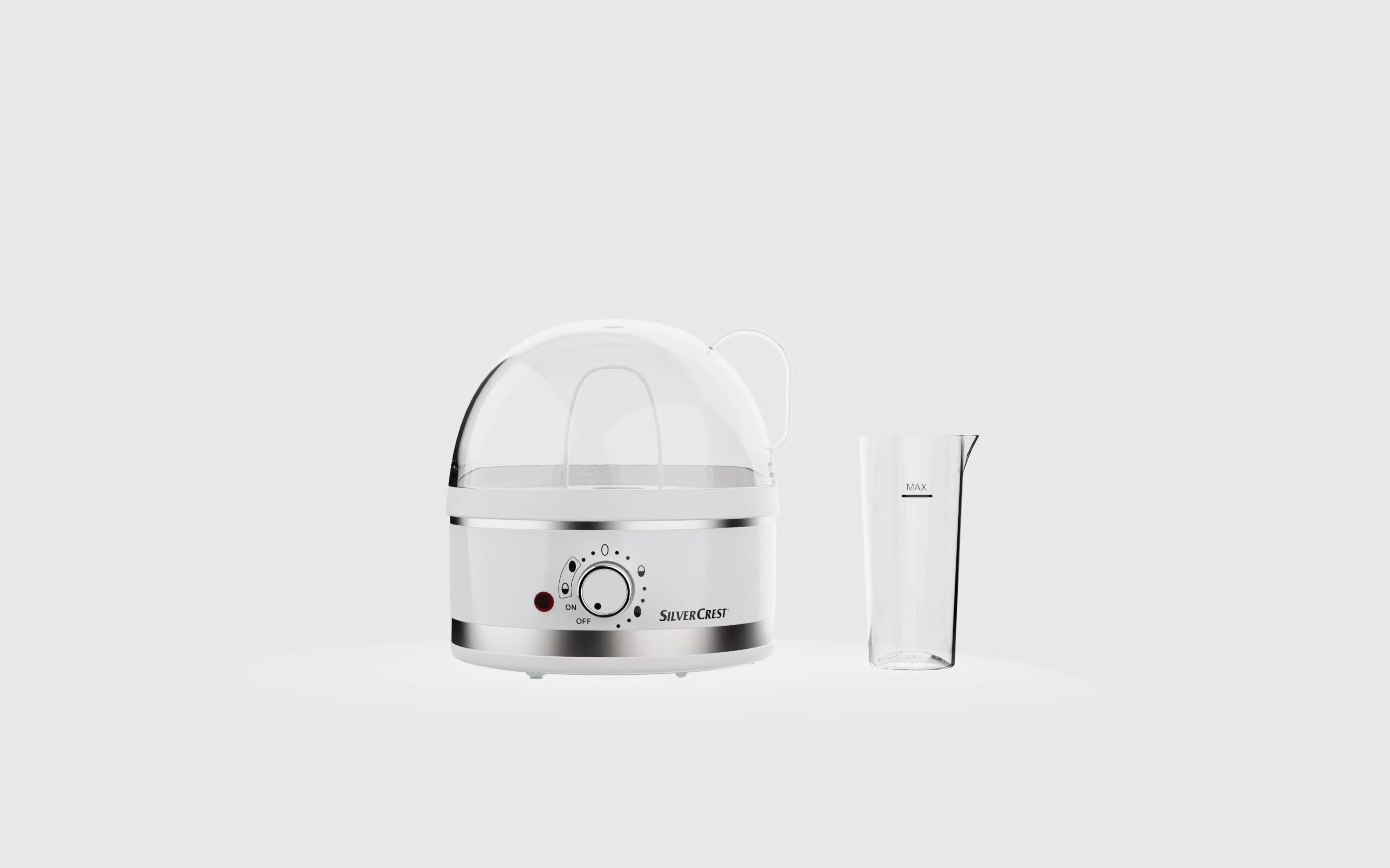 White kitchen appliance with a dome-shaped lid on a light gray background