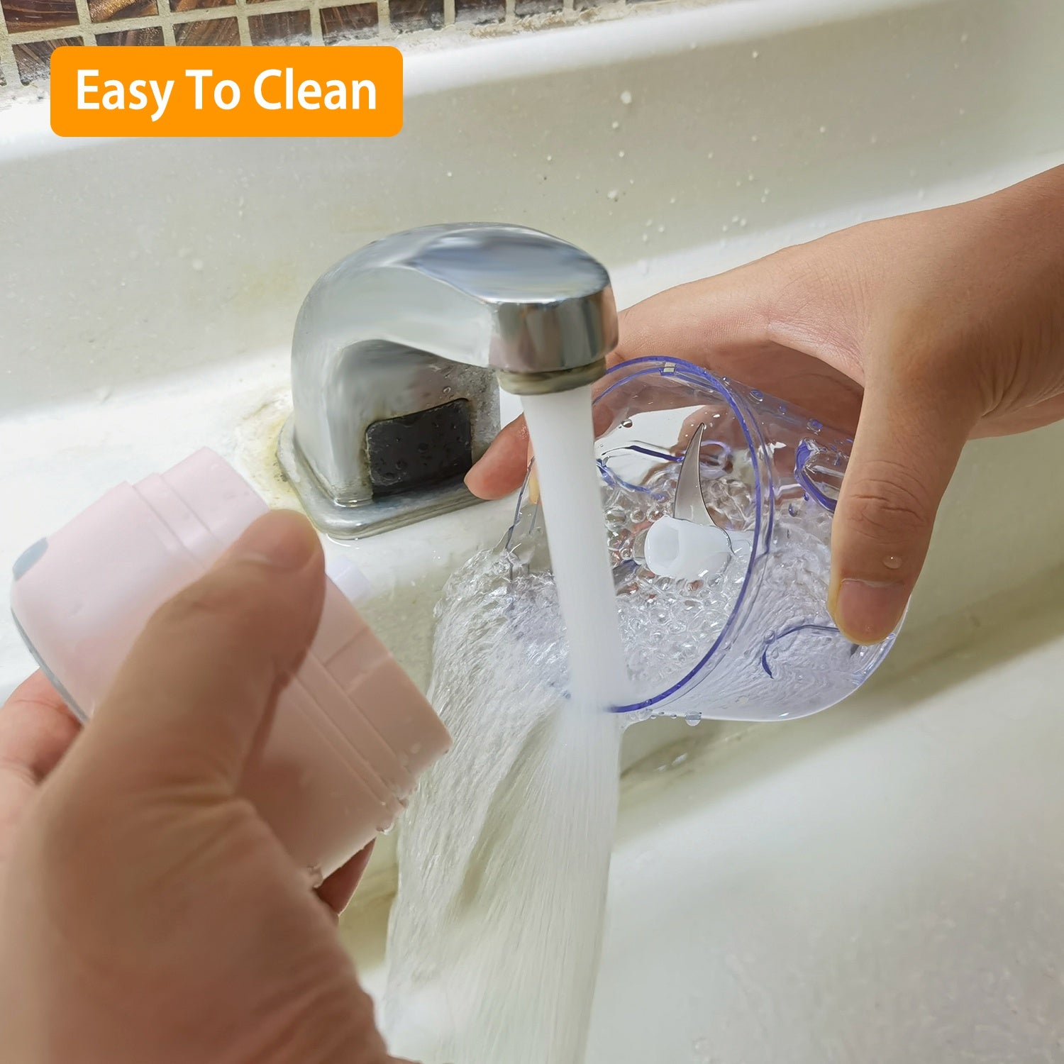 Person washing a plastic container under running water from a faucet with 'Easy To Clean' text above.