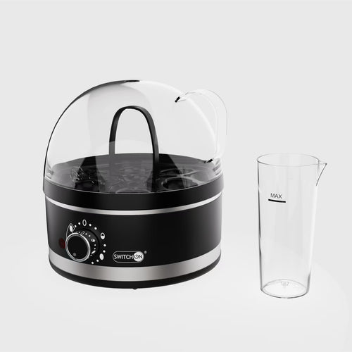 Black and silver egg cooker with a clear container on a white background
