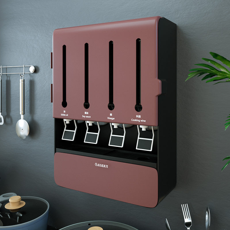 Wall-mounted condiment dispenser with multiple compartments on a dark gray wall.